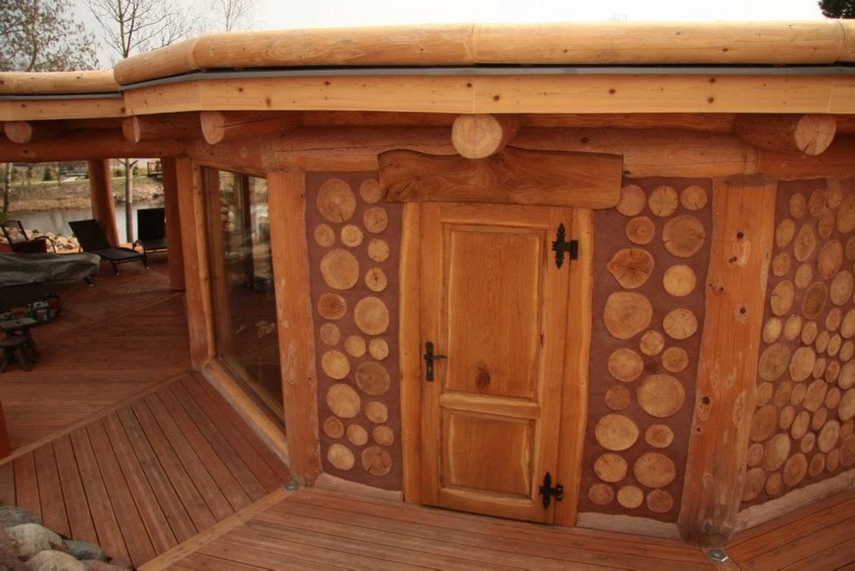 Log Framing with Cordwood Infill in Poland