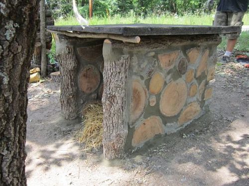 A cordwood dog house from Tim Halverson in Ohio.  A practice project before building his house!
